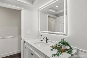 This energy efficient LED vanity mirror offers shadow free illumination while also adding a modern flair to this well used room.