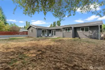 Whether you extend the patio area for an elaborate outdoor living area, or fill the yard with toys, this backyard is full of potential.