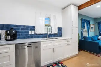 All new cabinetry, natural stone countertops, and designer tile backsplash.