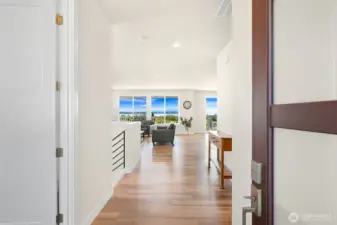 Spacious hallway creates a smooth transition from entry into the great room.