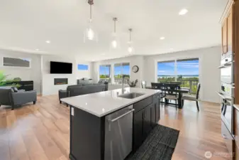 View from the open kitchen to the great room showcasing open floorplan.