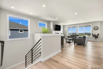 Open landing transitions seamlessly to lower lever enhancing the homes layout.