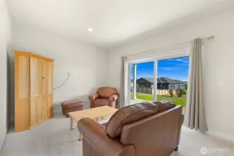 Downstairs Bonus Room with sliding glass door ground level access to backyard.