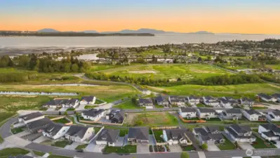 Stunning arial perspective capturing warm sunsets over the landscape & neighborhood.