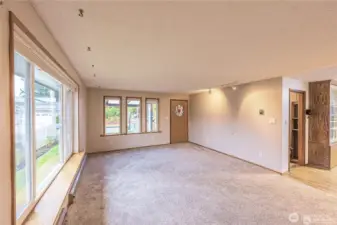 Light and bright living room with new carpets.