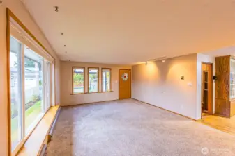 Light and bright living room with new carpets.