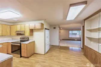 Mid-Century Modern kitchen with newer appliances. Nice flow from kitchen to living area.