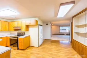 Mid-Century Modern kitchen with newer appliances. Nice flow from kitchen to living area.