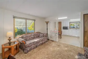 Living room and entrance to kitchen and eating area