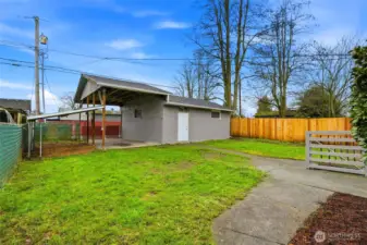 Fully fenced yard w/ rare detached 2-car garage and RV covered parking...