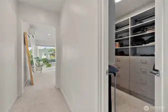 HUGE custom walk in closet with built ins.