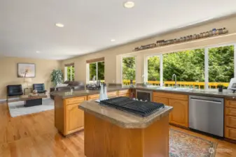 Step into the heart of the home and discover a dream kitchen built for entertaining and featuring newer stainless-steel appliances, a charming double door pantry, granite countertops, and adjacent breakfast bar and family room.
