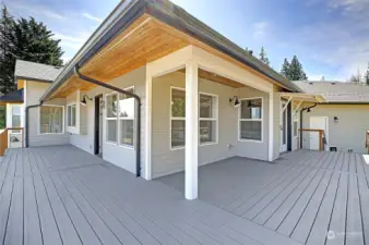 HUGE deck for entertaining spilling out onto patio.