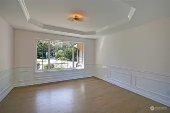 Wainscotting and tray ceiling in formal Dining Room. So many entertaining spaces!