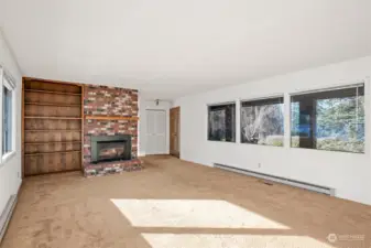 Living room overlooks acreage with privacy.