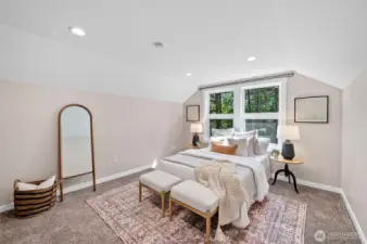 Feels big and airy and looks out at the forest.