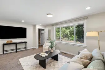 Living room with peek at separate entrance to upstairs