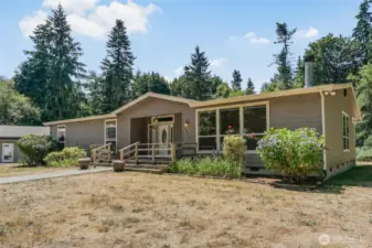 Semi-circular driveway allows for easy entry and exit to your 12.88 subdividable acres, 2,784sqft 3 bedroom home and 2,698sqft shop.