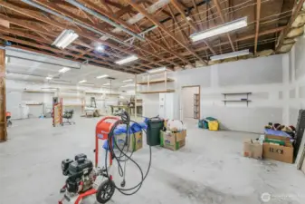 The Shop/Garage dreams are made of! 38x71 (2,698sqft) 4-Bay detached garage/shop with full 10x25 insulated storage room and a 38X25 finished and insulated hobby room with sliding glass doors to its own patio.  220 outlets, air compressor and a 440 outlet in the garage. Pellet stove is installed in the insulated hobby room and the room is plumbed for a potential bathroom.