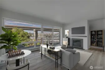 The living room showcases expansive, oversized windows that fill the space with natural light. New flooring adds a fresh, modern touch while still preserving the home’s original charm.