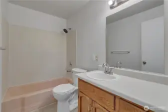 Full bathroom featuring a spacious countertop