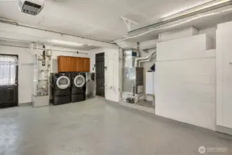 Utility room located in garage with rust-oleum flooring.