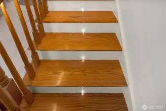 Staircase features custom built-in lights that change colors.