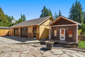 Newly updated studio-like outbuilding next to detached garage.