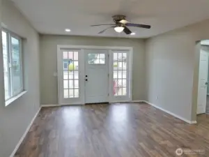 Light and Bright Entry and Living Room w/ LVP flooring.