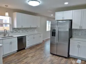 Kitchen w/ Stainless Steel appliances.