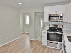 Kitchen ... leads into the Dining Nook (left) and the Laundry Room (right).