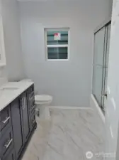 Stylish and beautuful re-done Bathroom with tile floors.
