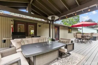 Backyard Retreat – Trex deck with well-maintained hot tub, and covered cabana seating.