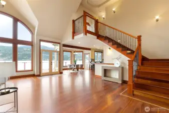 A spacious entry and beautiful Brazillian cherry floors welcomes guests.
