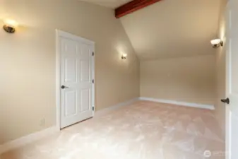 Through the primary closet is a secluded bonus room for your home office or peaceful reading nook.