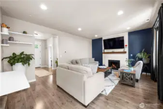 Warm and inviting living space with a beautiful fireplace centerpiece.