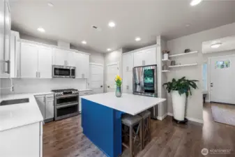 Thoughtfully designed kitchen with upgraded pull-out shelving for easy organization.