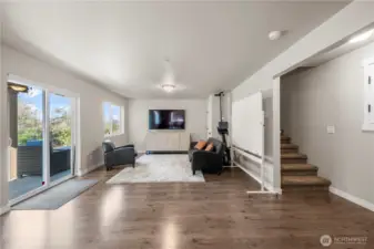 Versatile lower level space with private entrance and full bath.