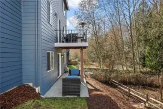 Deck overlooking a tranquil greenbelt—perfect for relaxing outdoors.