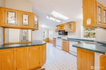 Kitchen has eat-in countertop/bar area and tons of counter space.