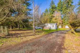 Property has a separate entrance/drive to the Shop and storage area- lots of potential for someone looking to maximize their investment.