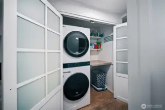 Clever design in the laundry, with a laundry tower, which allows space for a folding table, folding rack and more storage. Washer/dryer tower is included in the sale for a truly turn-key home