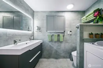 The list of features in the primary bath grows, with handsfree faucet, dimmable and steam reducing mirror, remote controlled bidet