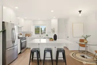 Watch activity in the back yard right from the kitchen window. Or, maybe even the bartender handing out cocktails to the guests on the deck during the summer!