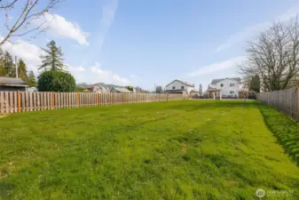 Waaaaaayyyy in the distance... there is the home! Yes, this is your HUGE, level, private yard! So easy to maintain, while providing you so much space to enjoy! No restrictions in the yard either - no water lines, septic or anything preventing your use. Some use for additional storage buildings, RV parking, or bring the entire soccer team! Add a pickleball court?!?