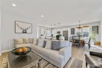 Living room with high quality furnishings, decor and fireplace.