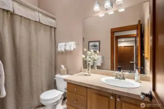 Full bath in the hallway adjacent the 3rd bedroom.