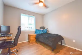 Bright bedroom with updated flooring and ready for high-speed internet.