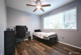 Generously sized bedroom with new flooring and built-in high-speed internet connectivity.