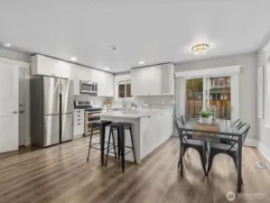 The dining room includes doors to the patio. Easy care LVP floors run throughout this home.